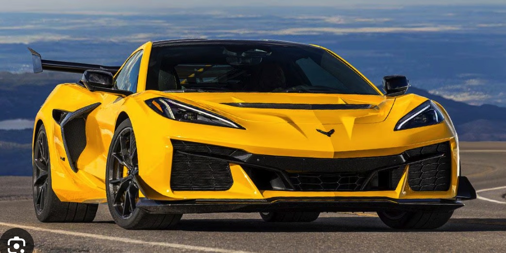 The original photo of a yellow sports car on a road